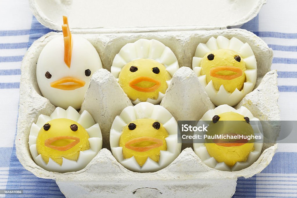 Boiled egg chickens in box Boiled egg chickens in box on blue table cloth April Stock Photo