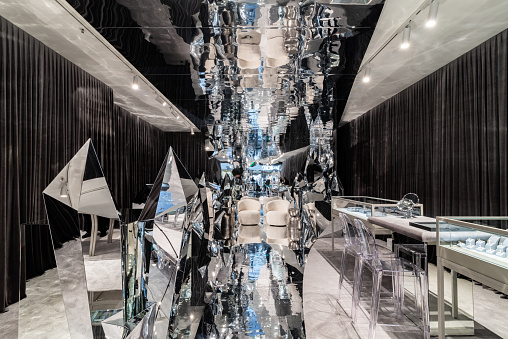 A very modern interior design of a jewellery store. Lots of of glass and mirror elements to give a bigger size feeling.