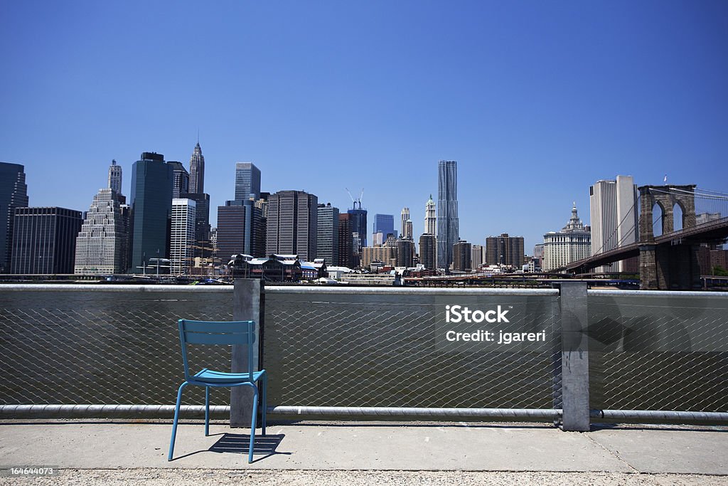 New York City skyline The Financial District and Lower Manhattan with the Brooklyn Bridge on the left.  View from Brooklyn Heights Architecture Stock Photo