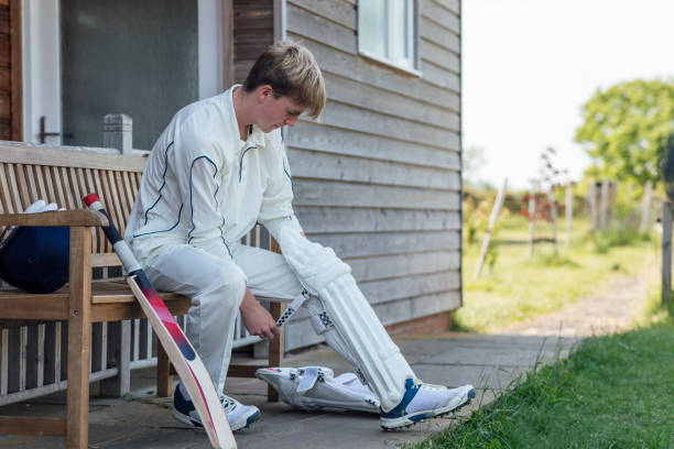 istock Putting on Wicket Shin Pads 1646442662