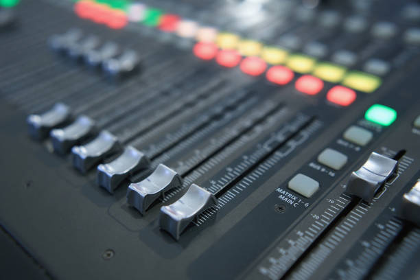 istock Professional audio mixing console. ​Mixer. Pro audio mixing board faders and knobs. Static shot of multi-track music recording equipment faders and sliders. 1646444070