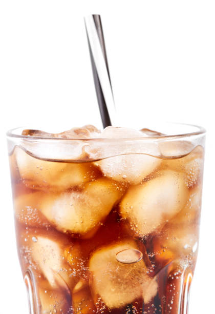 istock Cola in glass with straw and ice cubes isolated on white background. Soda with bubbles isolated on white. Refreshing non-alcoholic drink 1646445603