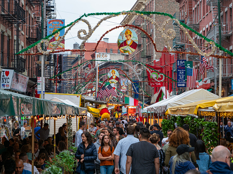 Crowds gather in Mulberry Street to celebrate San Gennaro, New York. The Feast of San Gennaro, an Italian-American festival held annually in September in the Little Italy since 1926., nyc. usa.