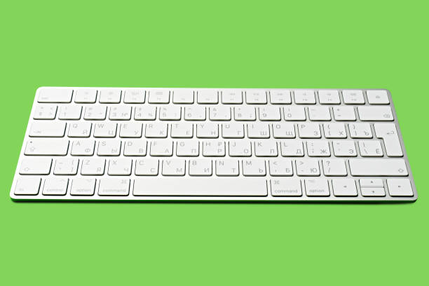 istock Woman Typing On A Keyboard White wireless computer keyboard isolated on white background. Russian / English keyboard layout. 1646455828