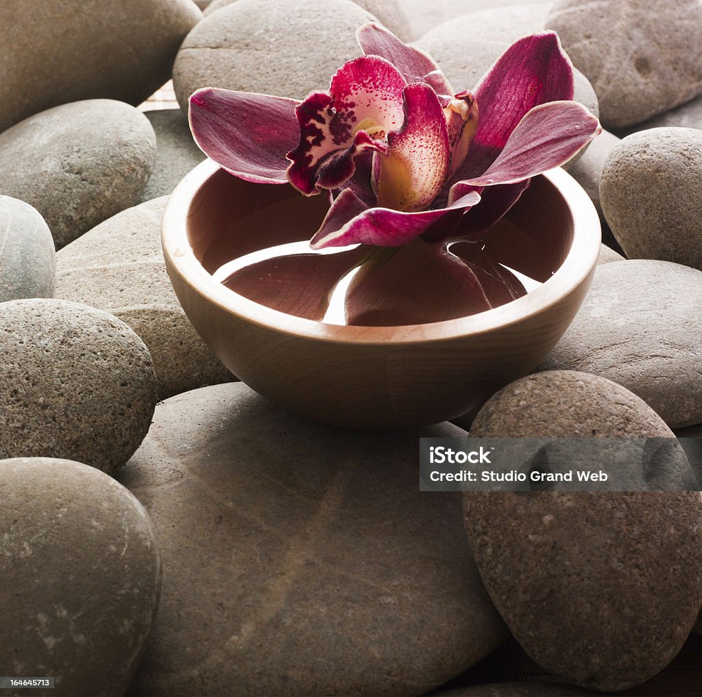 ayurveda symbol orchid in water for ayurveda ambiance Ayurveda Stock Photo