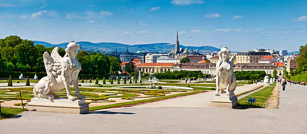 Belvedere Palace of Vienna with Sphinx sculptures View on the city from the Upper Belvedere Palace with the historic garden in front. In the back the St. Stephen's Cathedral (German: Stephansdom) and the Viennese mountains Kahlenberg and Leopoldsberg. Focus on foreground st. stephens cathedral vienna photos stock pictures, royalty-free photos & images