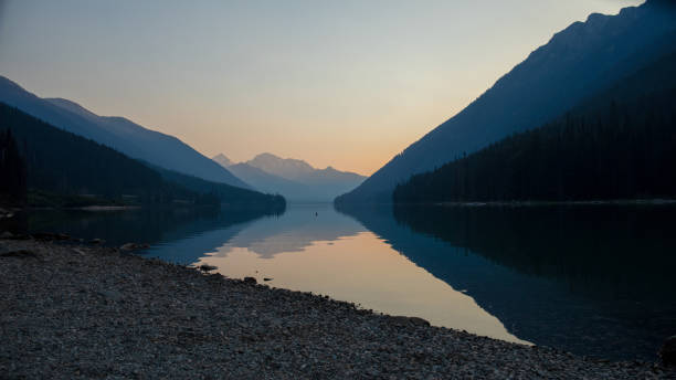 istock Dawn light on lake and mountains 1646466022