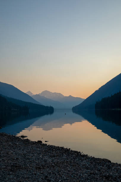 istock Dawn light on lake and mountains 1646466025
