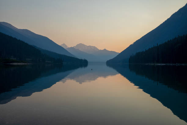 istock Dawn light on lake and mountains 1646466028