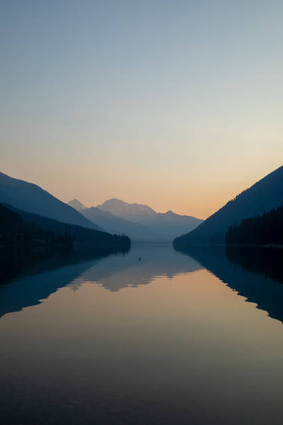 istock Dawn light on lake and mountains 1646466047