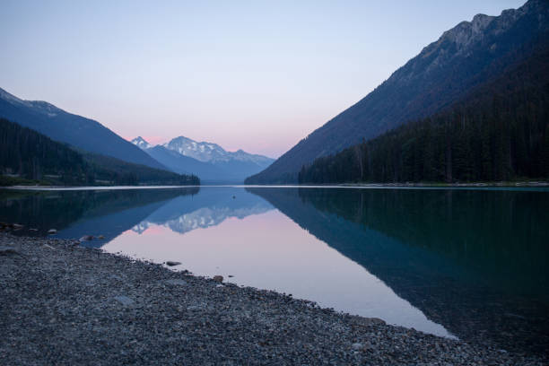 istock Dawn light on lake and mountains 1646466048