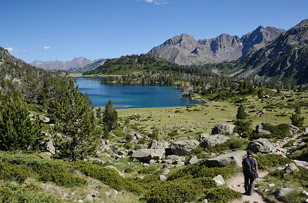 istock Hiker descending to the mountainous lake 164647131