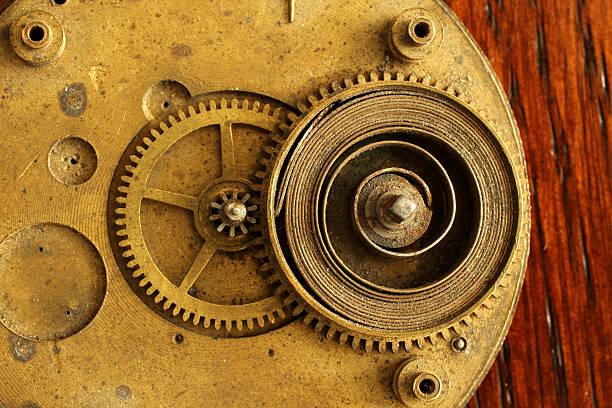 istock Macro Circular brass watch clock part with spring and gear 164648191