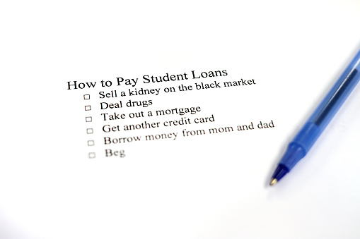 Written checklist of ideas for paying student loans off getting out of debt