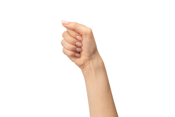 istock Hand of a woman holds some tiny or thin object. 1646492355