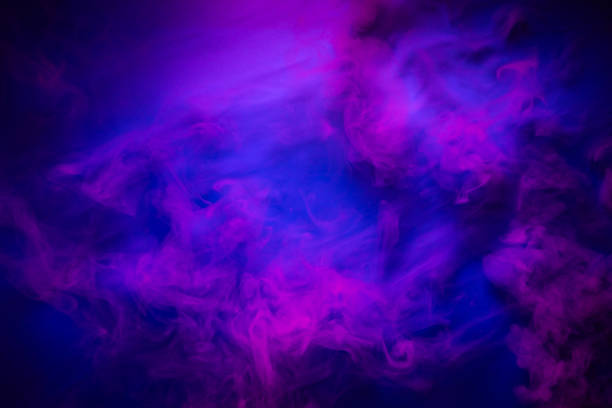 Red smoke on a blue background. Mystic texture in neon colors stock photo