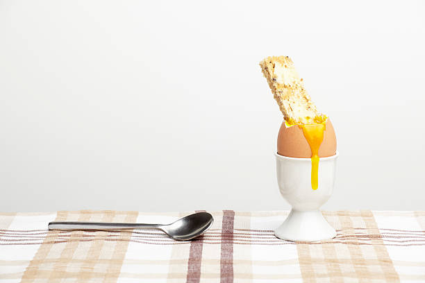 istock Boiled egg and spoon with toast soldier 164650470