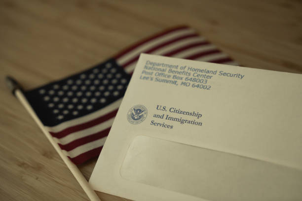istock USCIS envelope on blurred Flag of USA background 1646507915