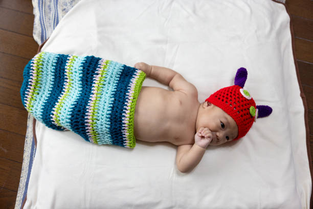 Portrait of baby lying on back