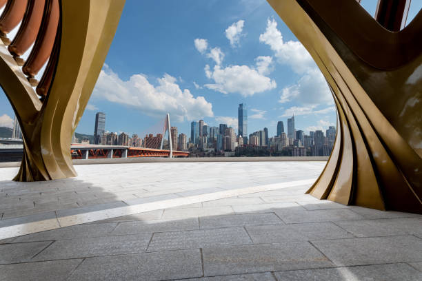istock empty concrete floor with cityscape  in the downtown street. 1646540639