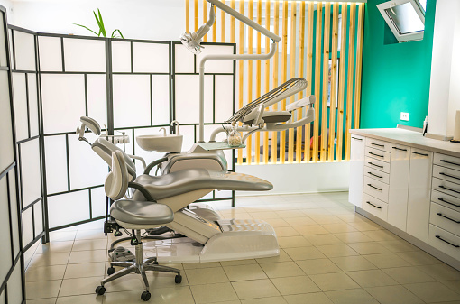 Interior of a modern dental office. Dental chair and dental instruments and tools