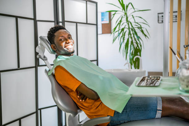 istock Young cheerful man in a dentist's office 1646549790