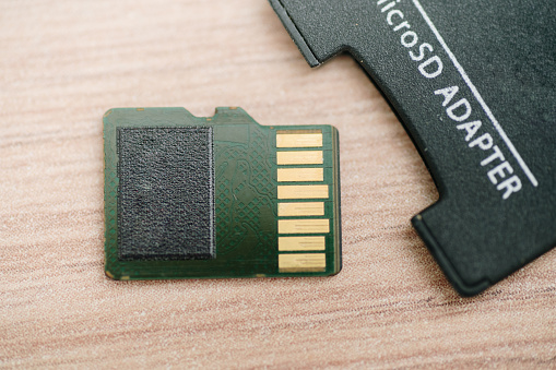 A micro SD card and adapter