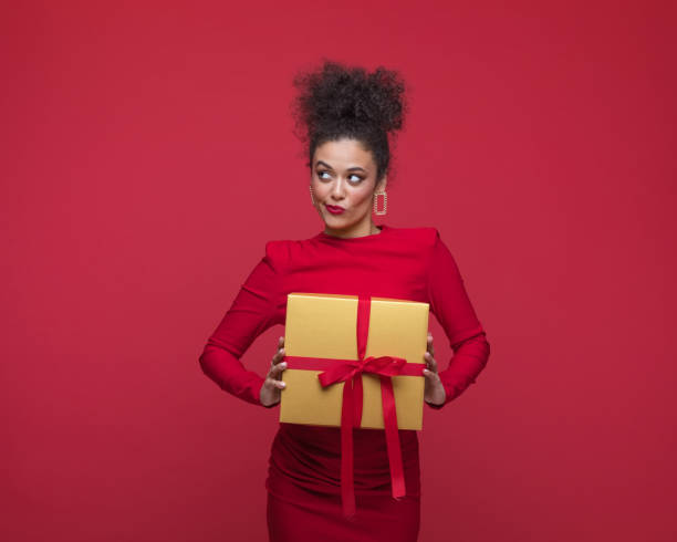 istock Surprised woman celebrating xmas 1646562008