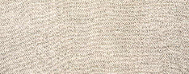 istock Texture of Light Beige or Sandy-Colored Cotton Fabric 1646570054