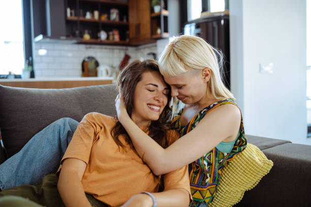 istock Beautiful lesbian couple at home 1646571314