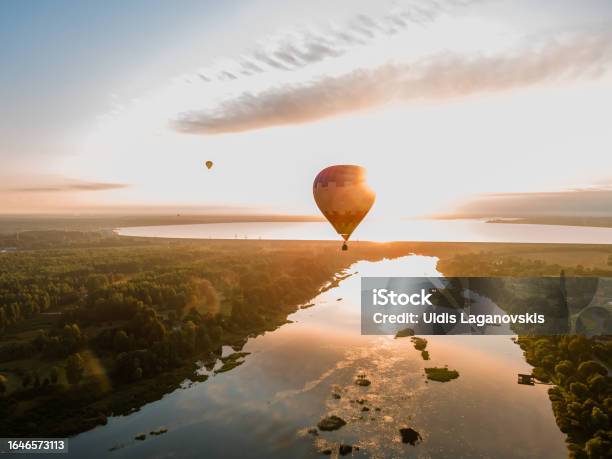 Hot Air Balloon Is Flying At Sunrise Or Sunset Aerial Drone View Stock Photo - Download Image Now