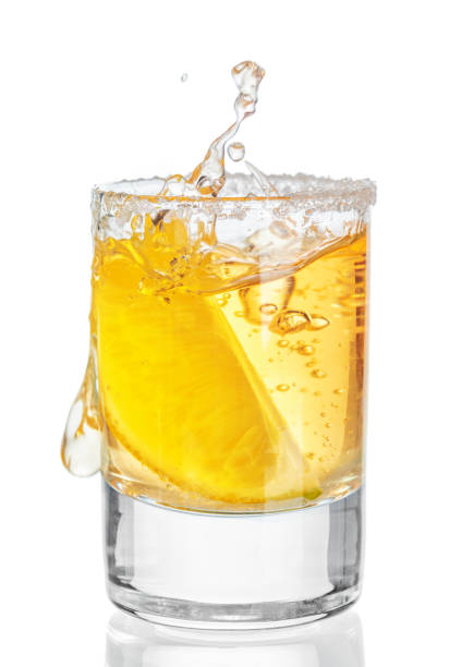 istock Gold tequila shot isolated on white background 1646574877