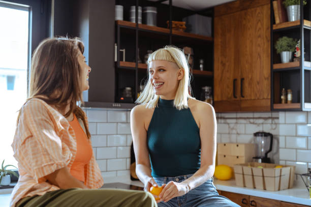 istock Lesbian couple chatting  and relaxed at home 1646577883
