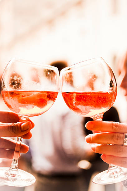 istock Two hands toasting glasses of wine 164657906