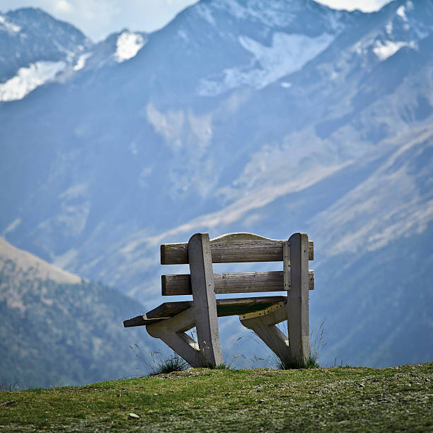 istock Single Wooden Bench in Mountain 164658605