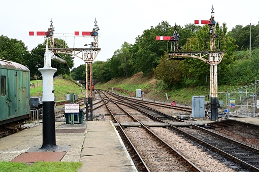 Four Semaphore signals at a vintage railway station.