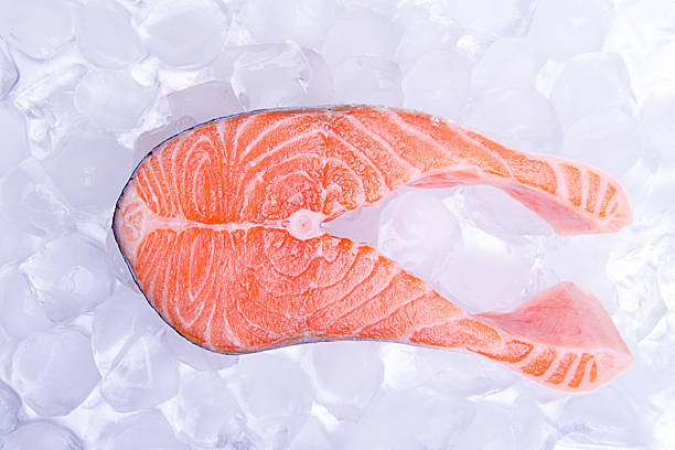 istock One slice of red fish -salmon, on ice 164660746