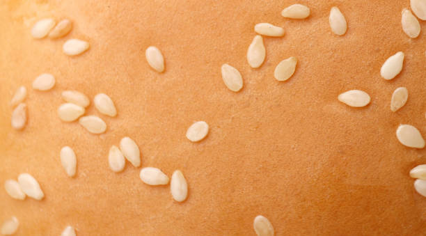 hamburger bun with sesame. seeds sesame on bun, top view. selective focus