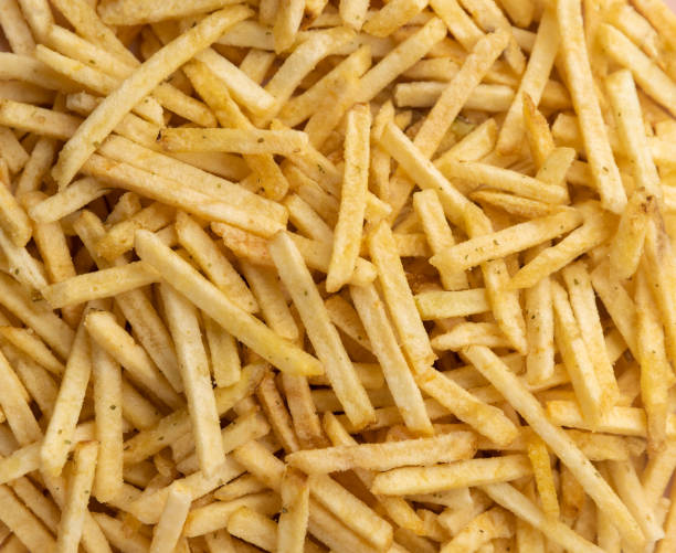 istock potato straws. potato background Macro. Falling potatoes, fries 1646611797