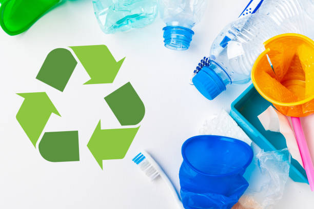 istock waste recycling eco symbol with garbage disposal on table background top 1646612362