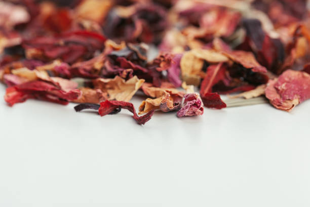 istock Dried tea leaves close up on white background 1646613921