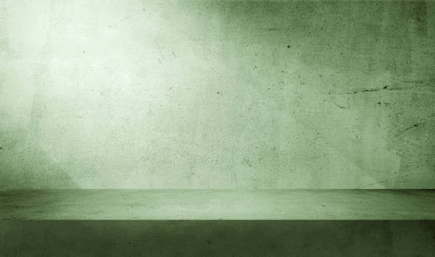 istock minimal abstract green concrete background with light for product displayed. shadow and light from windows on rustic plaster wall. green studio backdrop. cosmetic beauty presentation background. 1646617838