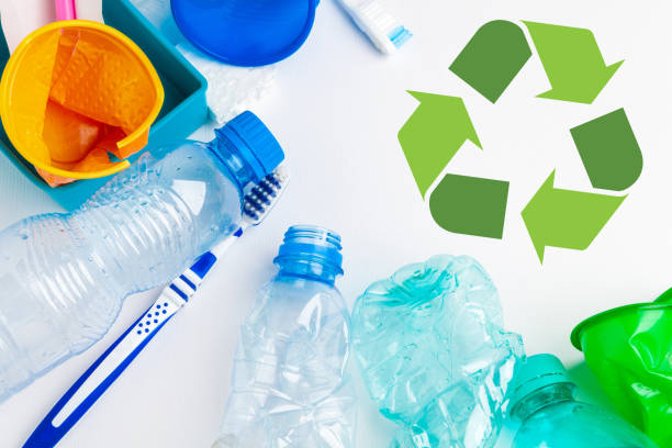 istock waste recycling eco symbol with garbage disposal on table background top 1646618386