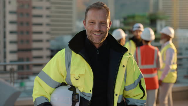 Man, face and construction worker, smile with architecture and maintenance, renovation and urban infrastructure. Portrait, happy and engineering, city buildings with contractor in London and handyman