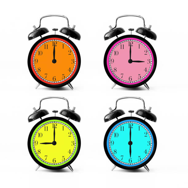 istock 4 Black alarm clocks with a bright dial of difference colors. 9, 12, 3, 6 o'clock 1646625581
