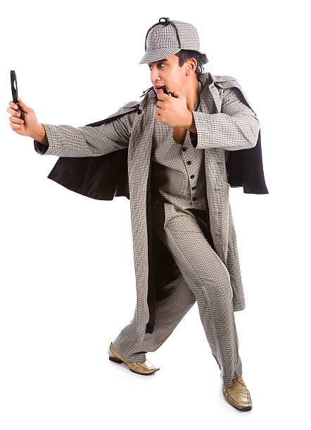 istock Curious Sherlock Holmes pipe and magnifying glass 164662876