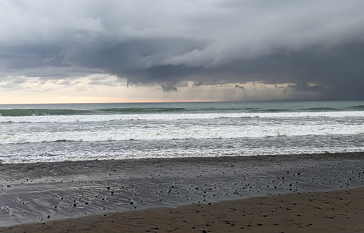 Jaco beach on the Pacific Coast Costa Rica and approaching rainstorm