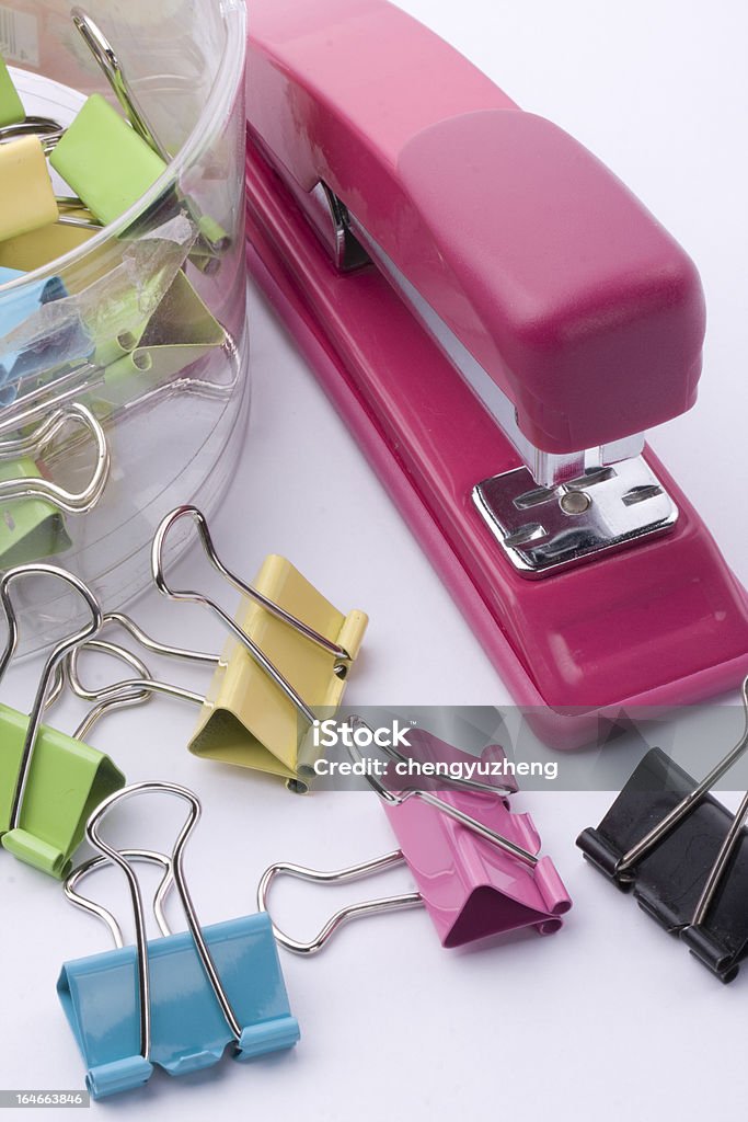 Color  paper clip and stapler Color paper clip and stapler  on white background Abstract Stock Photo