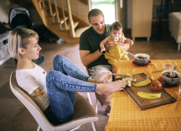 Disabled woman without hands prepares breakfast for her family