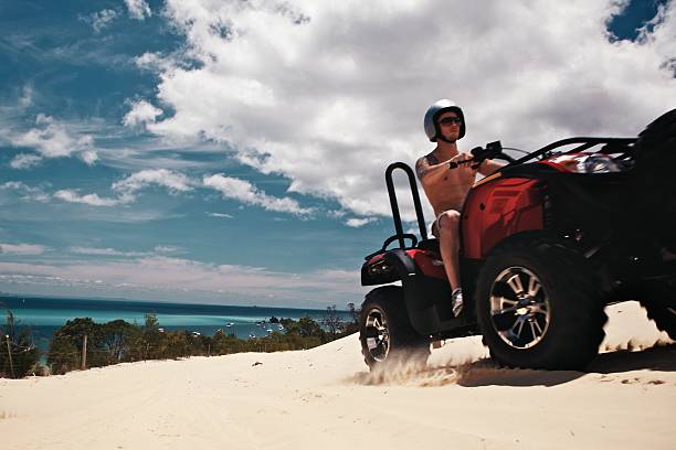 istock Driving Quad Bikes on Tropical Island 164665354